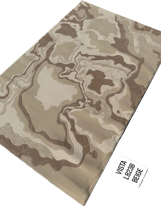 A rectangular area rug with an abstract, organic topographic pattern in shades of beige, tan, and brown, laid out on a gray paved surface. A white label in the bottom right corner reads 'VISTA L8238 BEIGE'.