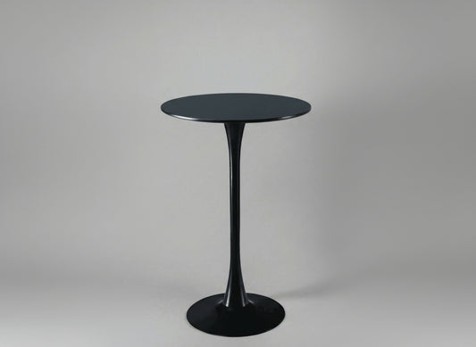 Black pedestal table on a gray background