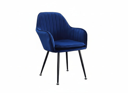 Blue velvet chair with black metal legs on a white background