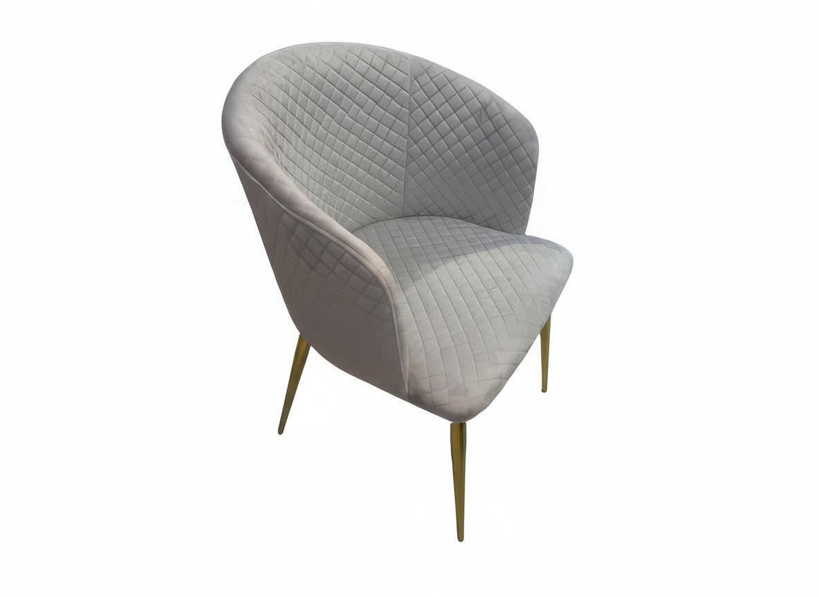 Gray quilted chair with gold legs on a white background